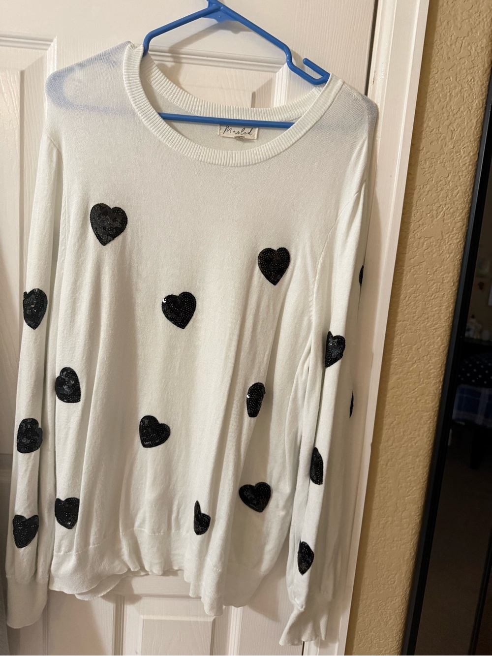 Marled White Crewneck Sweater with Black Heart Appliqués